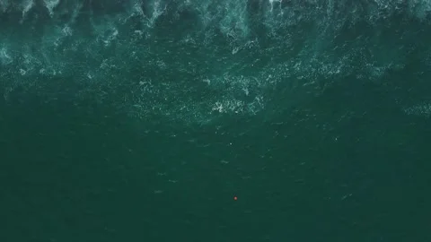 Drone view of sea waves crash on sandy shore. Stock Footage 314955769