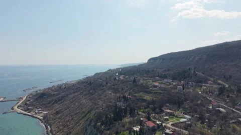 Drone view of seaside road across hills and rural landscape Video stock 331506126