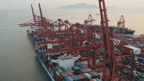 Drone view of shipping containers in a busy port at night Stock Footage 163691833