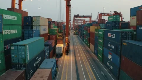 Drone view of shipping containers in a busy port at night Stock Footage 163691857