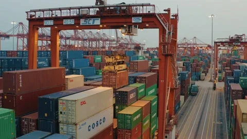 Drone view of shipping containers in a busy port at night Stock Footage 163691877