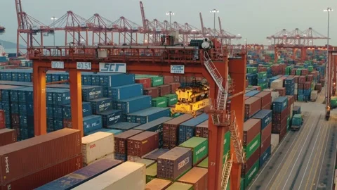 Drone view of shipping containers in a busy port at night Stock Footage 163691986