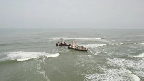 Drone view Shipwreck off the Atlantic Ocean coast of Africa Namibia Stock Footage 264020880