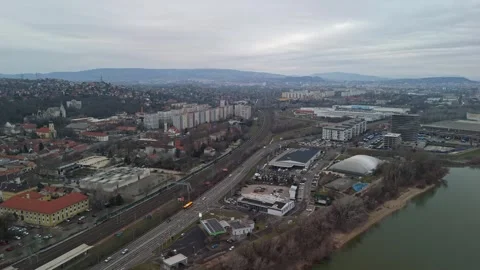 Drone view shows the Danube beside Budapest residential blocks under clouds Stock Footage 336468556
