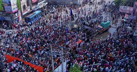 Drone view shows huge devotees dancing joyfully celebrating Ganesha immersion Stock Footage 340084288