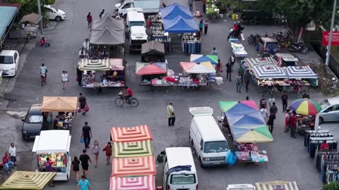 Drone view shows Juru pasar malam with shoppers enjoying tropical evening Stock Footage 332097436