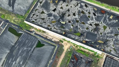 Drone view shows multiple lined waste containment ponds. Stock Footage 306899615