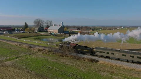 Drone View From the Side of an Antique Steam Passenger Train Traveling Thru.. Stock Footage 235958925