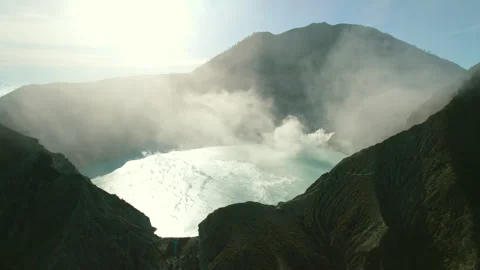 Drone view of silhouette shadow active volcano crater, caldera with acid lake Stock Footage 269112753