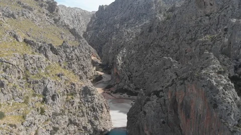 Drone view of small beach surrounded by mountains Stock Footage 126911536