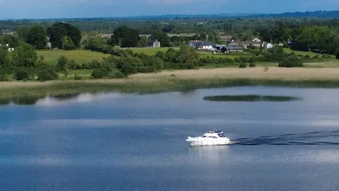 Drone view of a small boat navigating the River Shannon, Ireland. Stock Footage 310055031