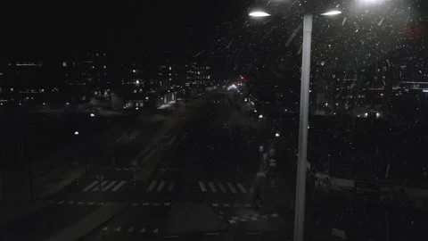 Drone view of small city one snowy december night in Sweden Stock Footage 145870405