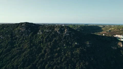 Drone view of a small house on the summit of a green hill. Stock Footage 219571540