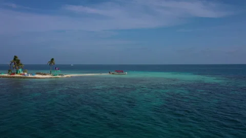 Drone View of Small Red Boat Near Caribbean Island in Blue Water 스톡 동영상 300273786