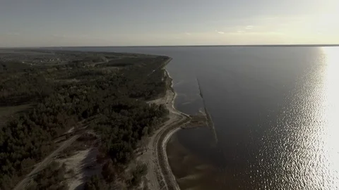 Drone view smooth flight straight Left forest right water camera looks straight Stock Footage 111874727