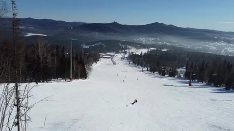 A drone view A snowboarder rides smoothly and softly on his board Stock Footage 329682263