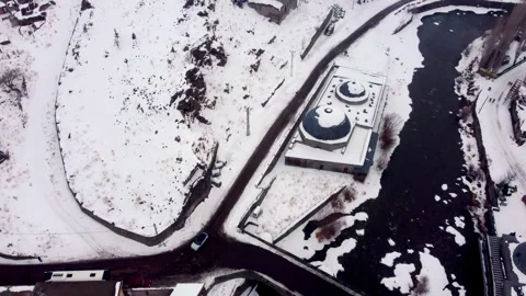 Drone View of Snowy Bridge Intersection and Kars River Waterfront in Winter Video stock 330884829