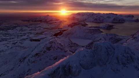 Drone view of Snowy Mountain Range Silhouette Sunrise Aerial View. Landscape Stock Footage 264376068