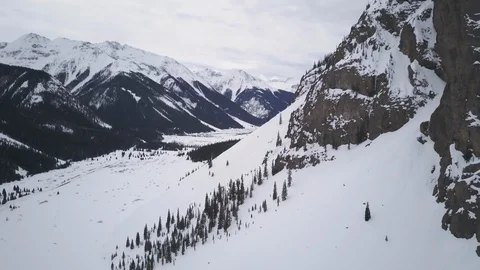 Drone view of snowy mountains and cloudy white sky in Colorado, USA Stock Footage 121591953