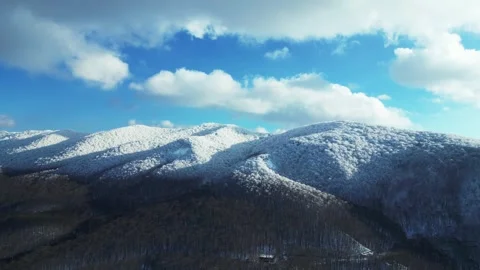 Drone View of Snowy Mountains and Frosted Trees Stock Footage 303486743