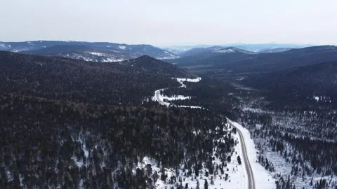 Drone View of Snowy Road to Ust-Koksa in Russia Stock Footage 313235175