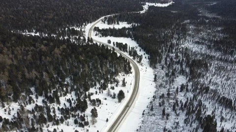 Drone View of Snowy Road to Ust-Koksa in Russia Stock Footage 313235297
