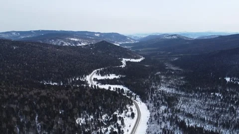Drone View of Snowy Road to Ust-Koksa in Russia Stock Footage 313242573