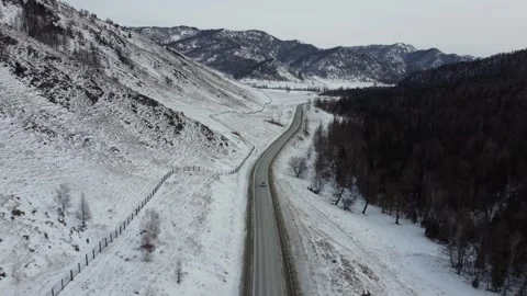 Drone View of Snowy Road to Ust-Koksa in Russia Stock Footage 313242842
