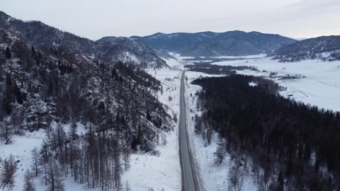 Drone View of Snowy Road to Ust-Koksa in Russia Stock Footage 313244747