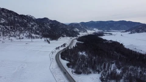 Drone View of Snowy Road to Ust-Koksa in Russia Stock Footage 313244761