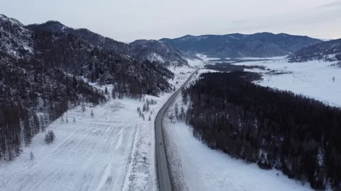Drone View of Snowy Road to Ust-Koksa in Russia Stock Footage 313244775