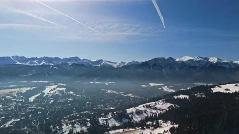 Drone view of snowy Tatra Mountains near Zakopane under clear winter sky Video stock 341047061