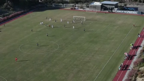 Drone view of soccer match at sunset Stock Footage 220457501