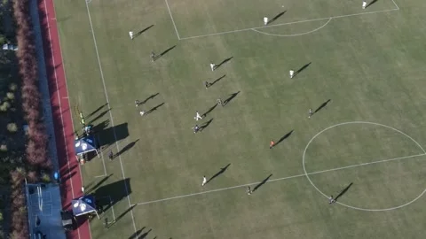 Drone view of soccer match at sunset Stock Footage 220457511