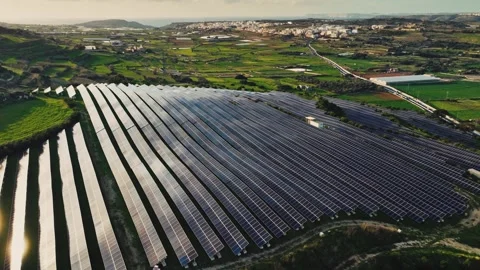 Drone view of solar panels, solar farm, sun quarry, sun panels. Green hills Stock Footage 300784307