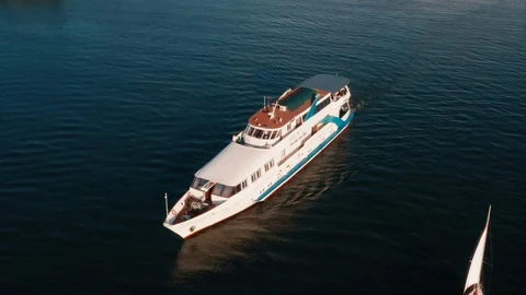 Drone view Span along the yacht suddenly in the frame enters the boat Stock Footage 111878612