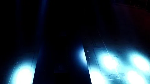 Drone view Span just above the empty podium under the twinkling spotlights Stock Footage 111874246