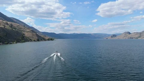 Drone view of a speed boat moving at high speed in Okanagan Lake Stock Footage 247943740