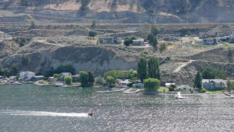 Drone view of a speed boat moving at high speed in Okanagan Lake Stock Footage 247943824