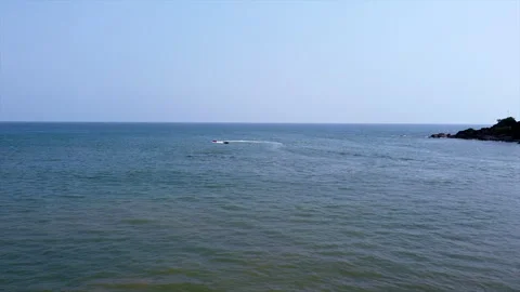Drone view speed boat pulling ballon sofa gokarna Stock Footage 276909762
