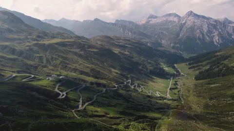 Drone view on Splugen Pass hairpin turns at sunset - Italy Switzerland Alps 스톡 동영상 319225842