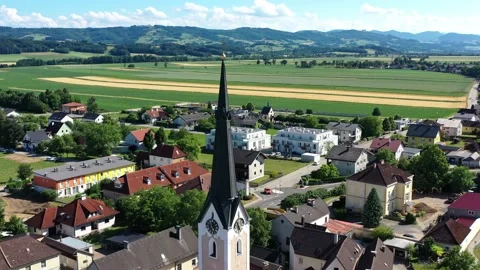 Drone view of the square in Hausmening, Austria. Old church in Tyrol Stock Footage 196125895