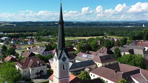 Drone view of the square in Hausmening, Austria. Old church in Tyrol Stock Footage 196126309