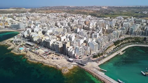 Drone view of St Paul's Bay seafront, marina and turquoise sea, Malta coast Stock Footage 339326793