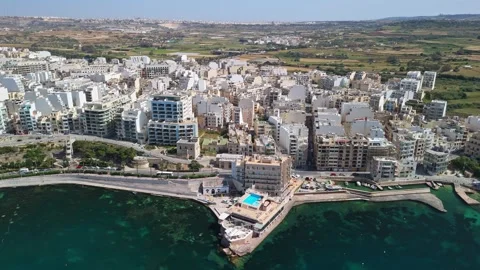 Drone view of St Paul's Bay and Bugibba marina on Malta's coastline in spring Stock Footage 339326819