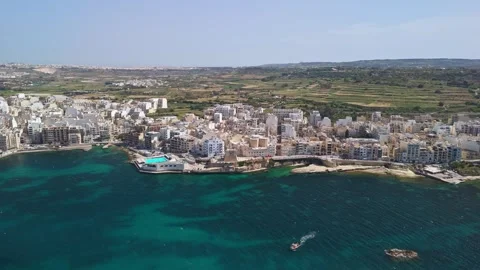 Drone view of St Paul's Bay and Bugibba waterfront on sunny Malta coast. Stock Footage 339326881