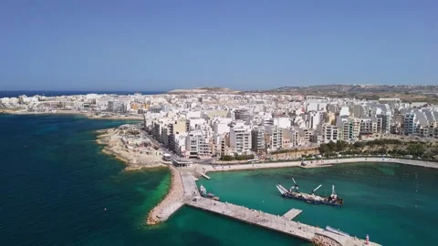 Drone view of St Paul's Bay harbor and Bugibba breakwater in spring sun Stock Footage 339327153