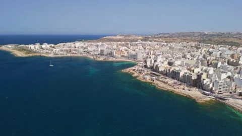 Drone view of St Paul's Bay, Bugibba and Qawra waterfront in Malta in spring Stock Footage 339327213