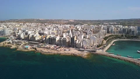 Drone view of St Paul's Bay marina and Bugibba coast on sunny day in Malta Stock Footage 339327239