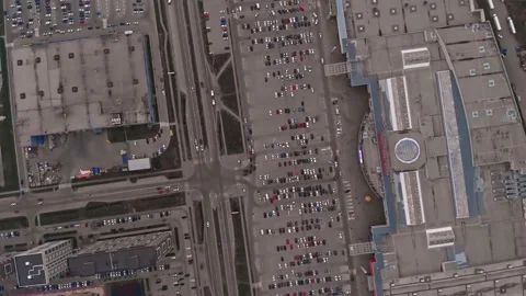A drone view of the stone jungles of a big city with a lot of traffic and a Stock Footage 203907723